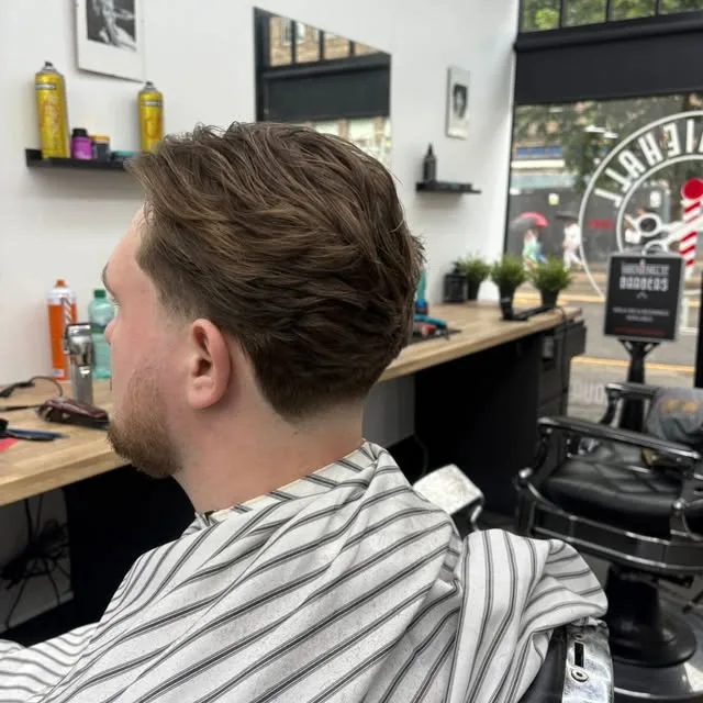 Natural tapered scissor cut from behind, by the Sauchiehall Street window