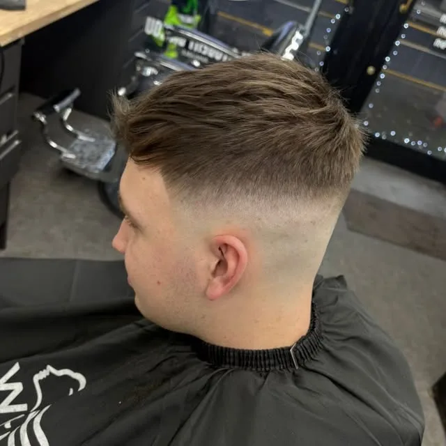 High skin fade with a textured crop, photographed in the chair at Sauchiehall Barbers